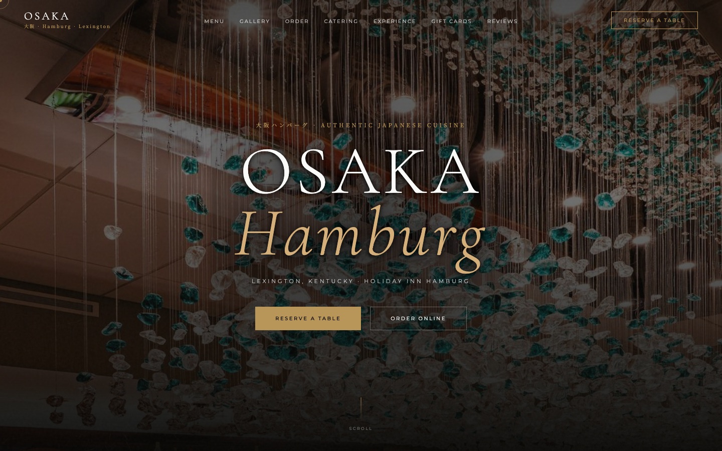 The Osaka Hamburg homepage: a dark cinematic hero photograph with the restaurant name in display type and clear reserve a table and order online buttons